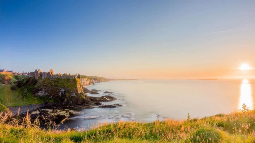 Sunset at Dunluce Castle in Co Antrim photograph taken by Kieran Hayes of Landscape Photography Ireland.
